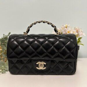 A brand new Chanel classic rectangular flap bag, made of black lambskin with a g